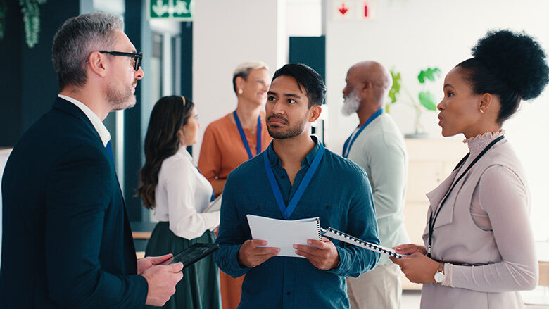 Seminar attendees talking in a small group