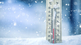 Thermometer on snow shows very low temperatures